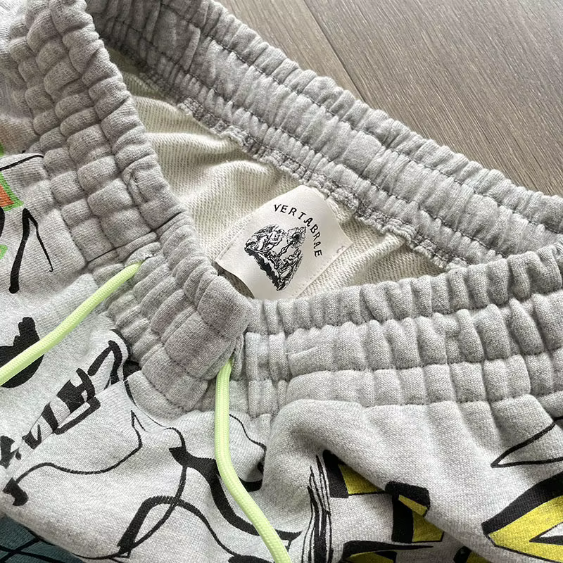 Shorts Vertabrae Verty colorés avec imprimé graffiti peint à la main, design à cordon de serrage, shorts de sport