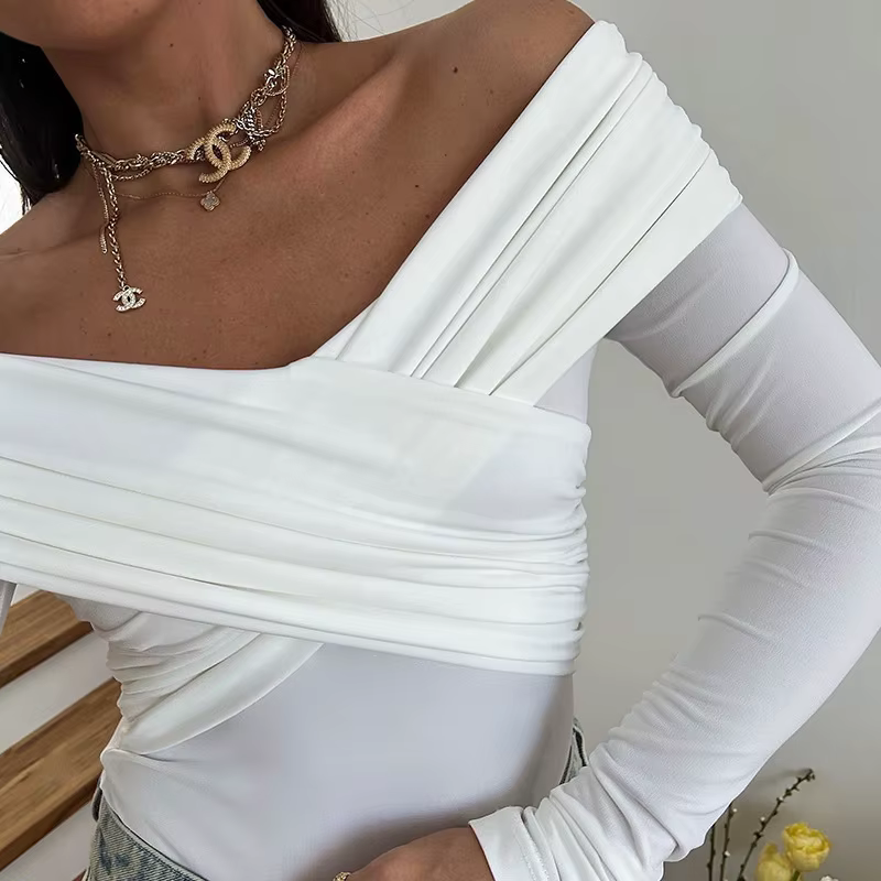 Nouveaux Bodys pour femmes Automne Sexy Dos nu Uni Corset Ajusté Mode Croisé Manches longues Décontracté Élégant